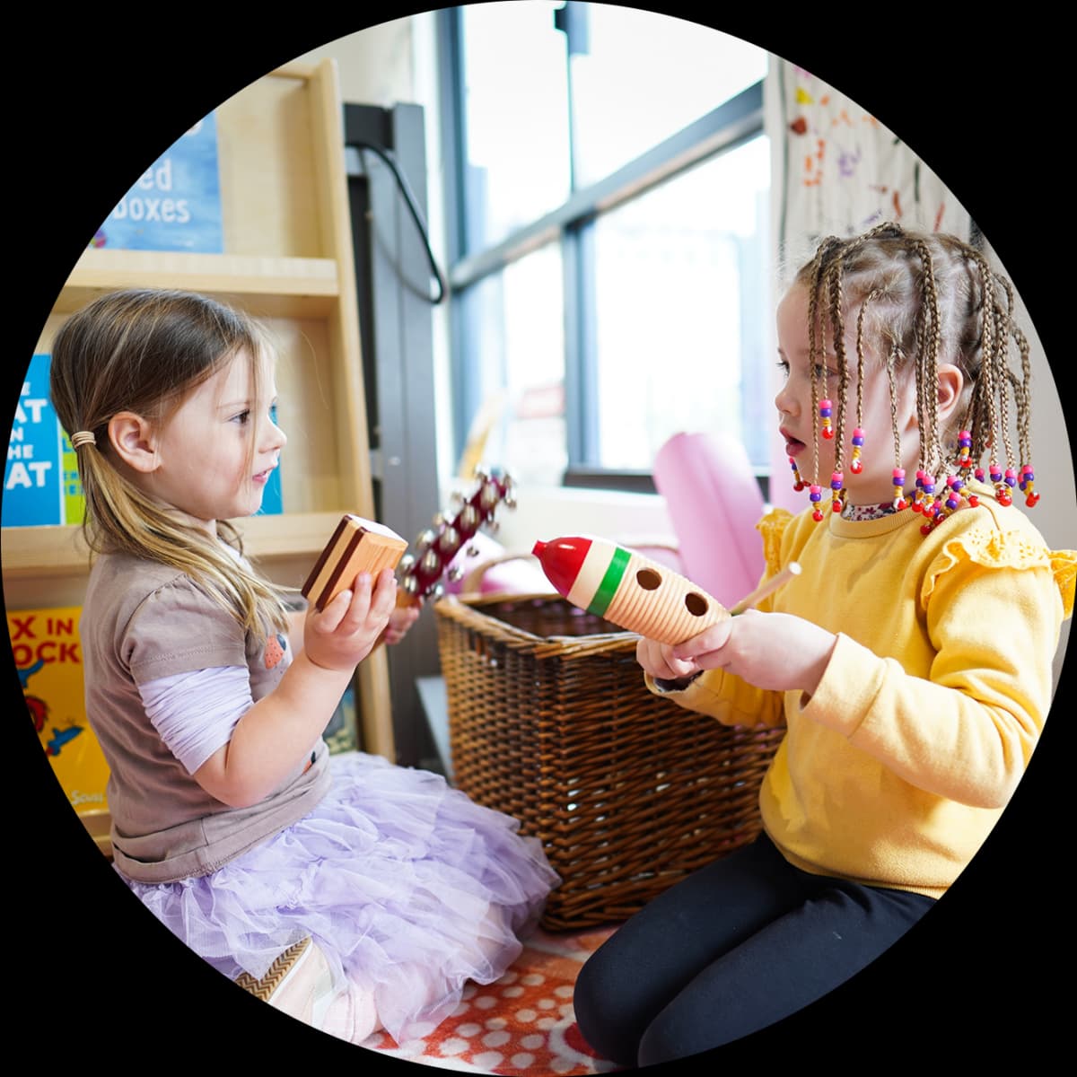 Kindergarten children learning through music with friends