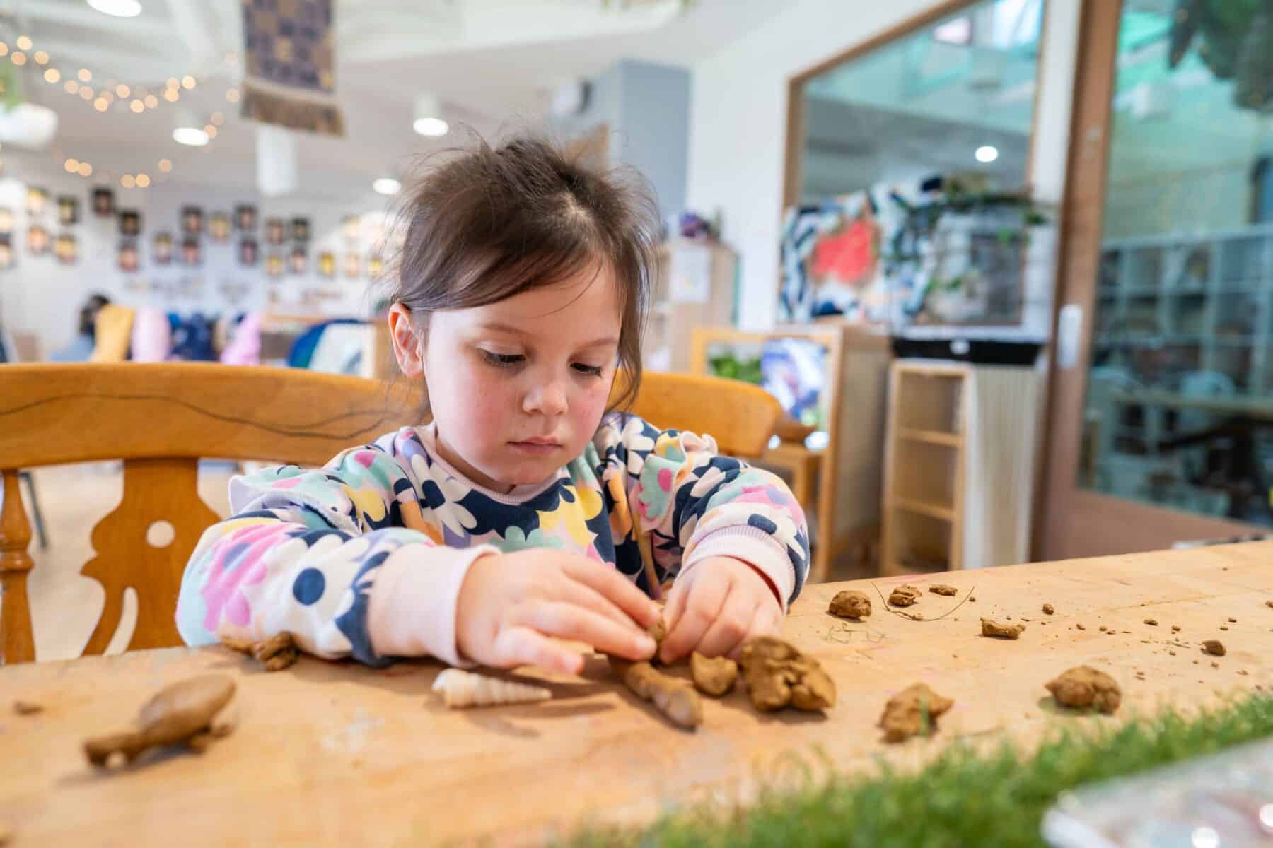 Kindergarten children exploring materials and ideas together