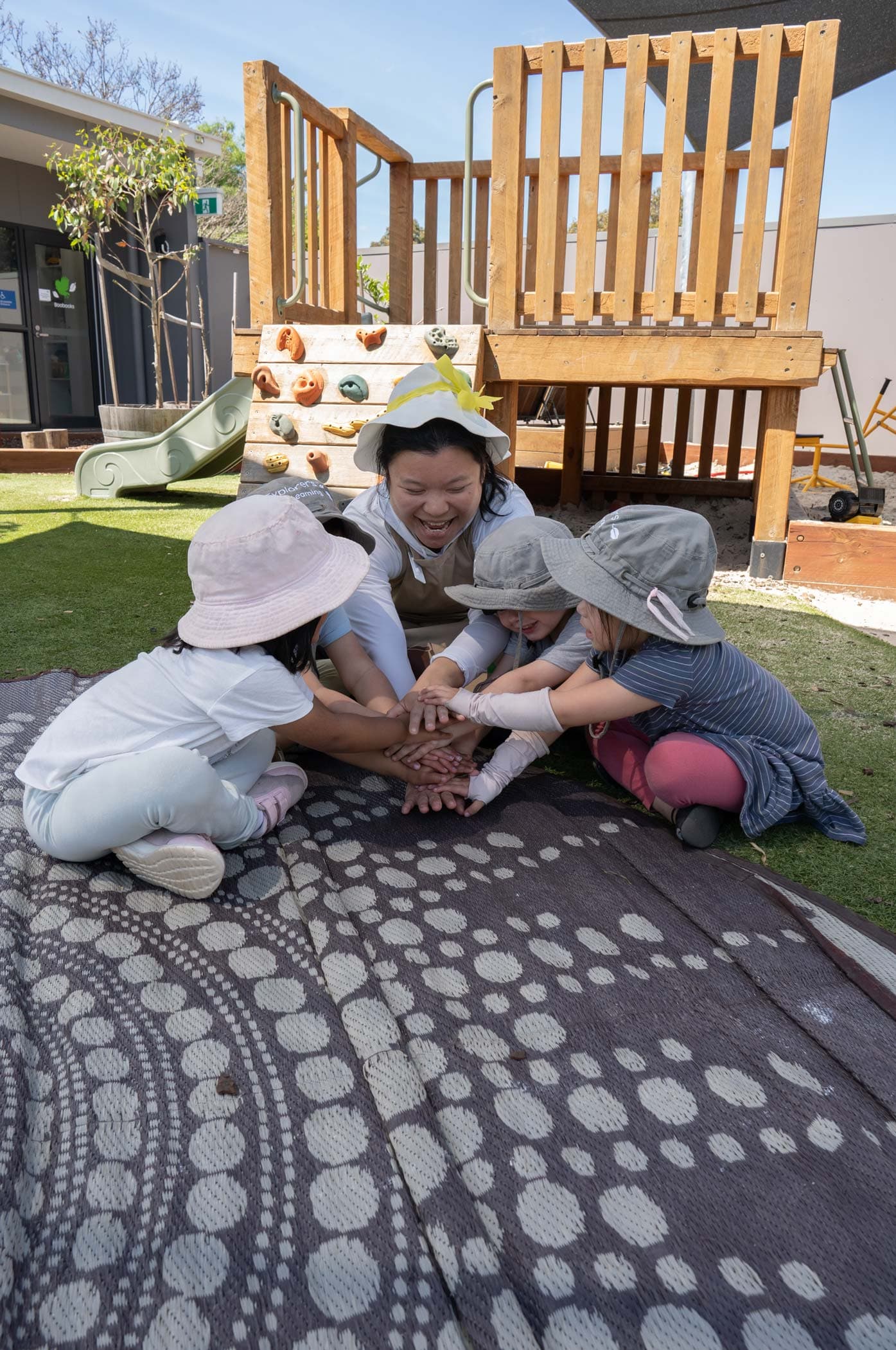 Educator documenting a child's learning at Explorers