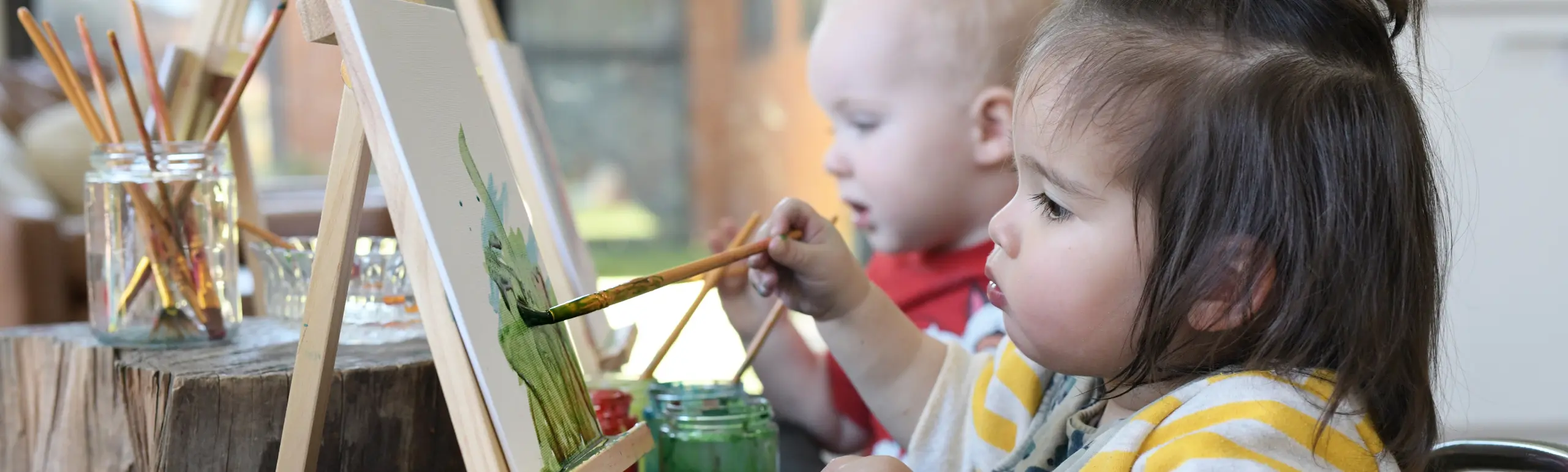 Toddlers exploring a play-based learning space at Explorers