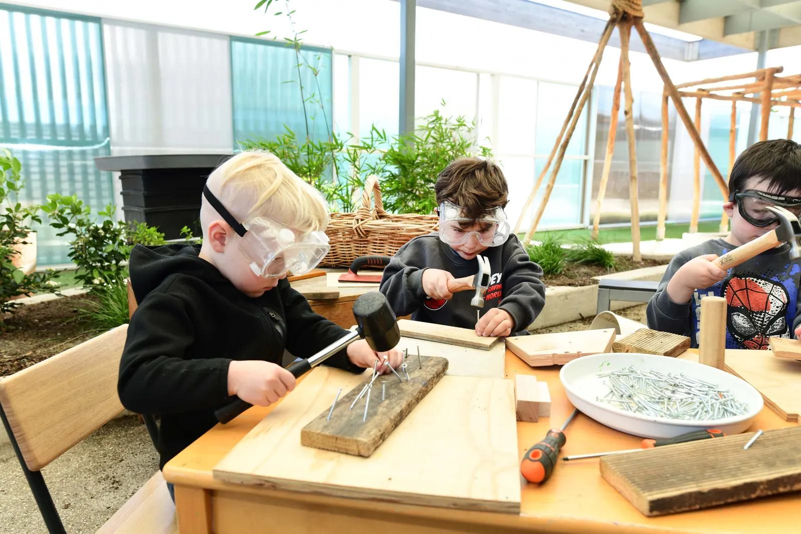 Children exploring creative making and building together