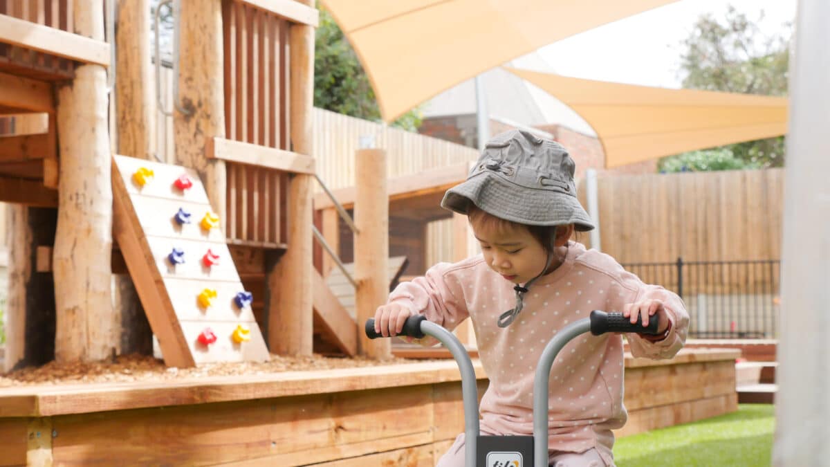 Child playing outdoors at an Explorers early learning centre
