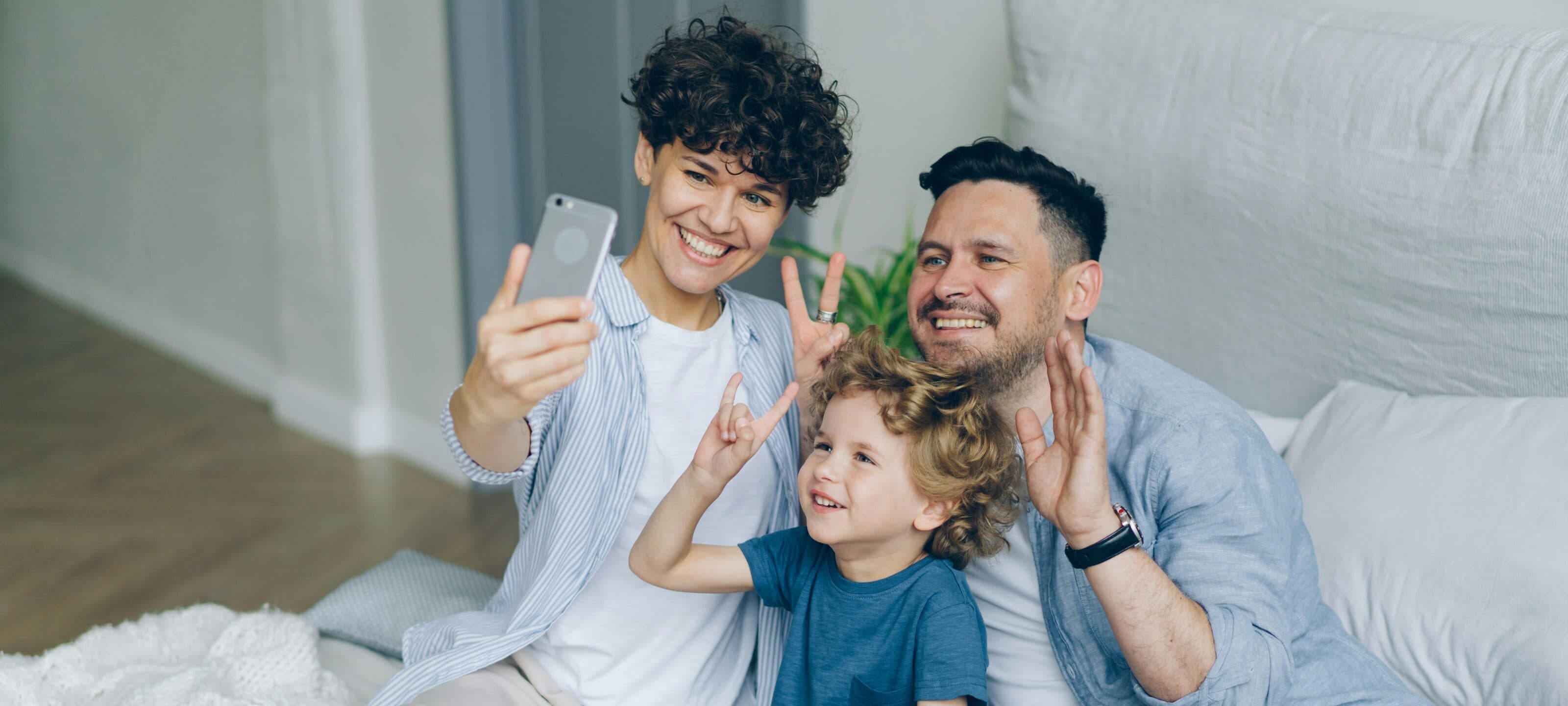 Family taking a photo social media