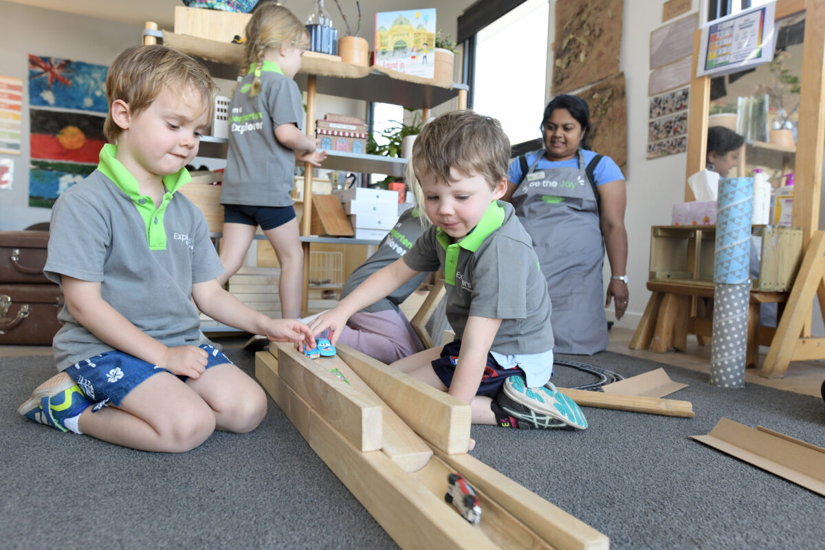 children playing with cars  in the centre