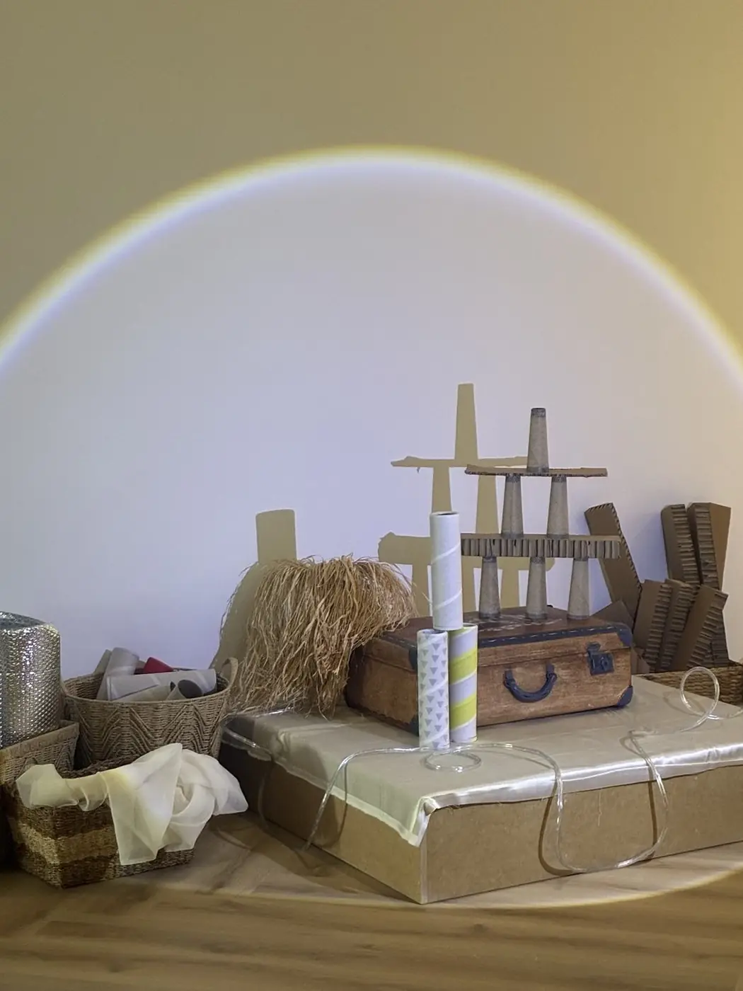 Open-ended loose parts and natural materials set up for a curriculum provocation